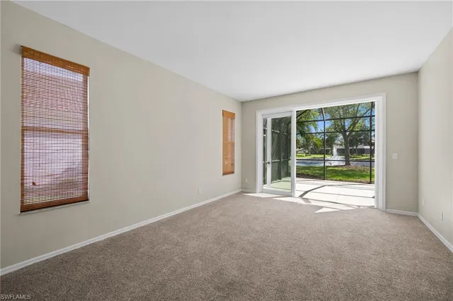 a view of an empty room with a large window