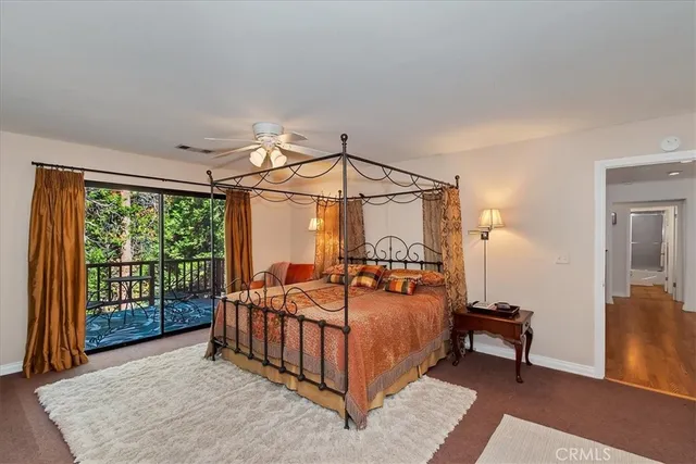 a bedroom with a bed a lamp and a window