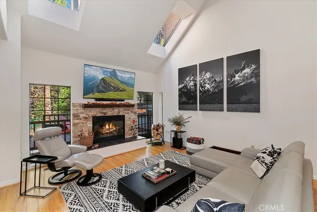 a living room with furniture fireplace and window