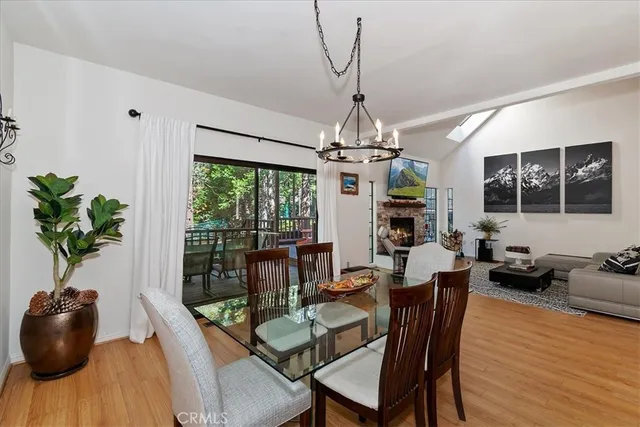 a view of a dining room with furniture wooden floor and chandelier