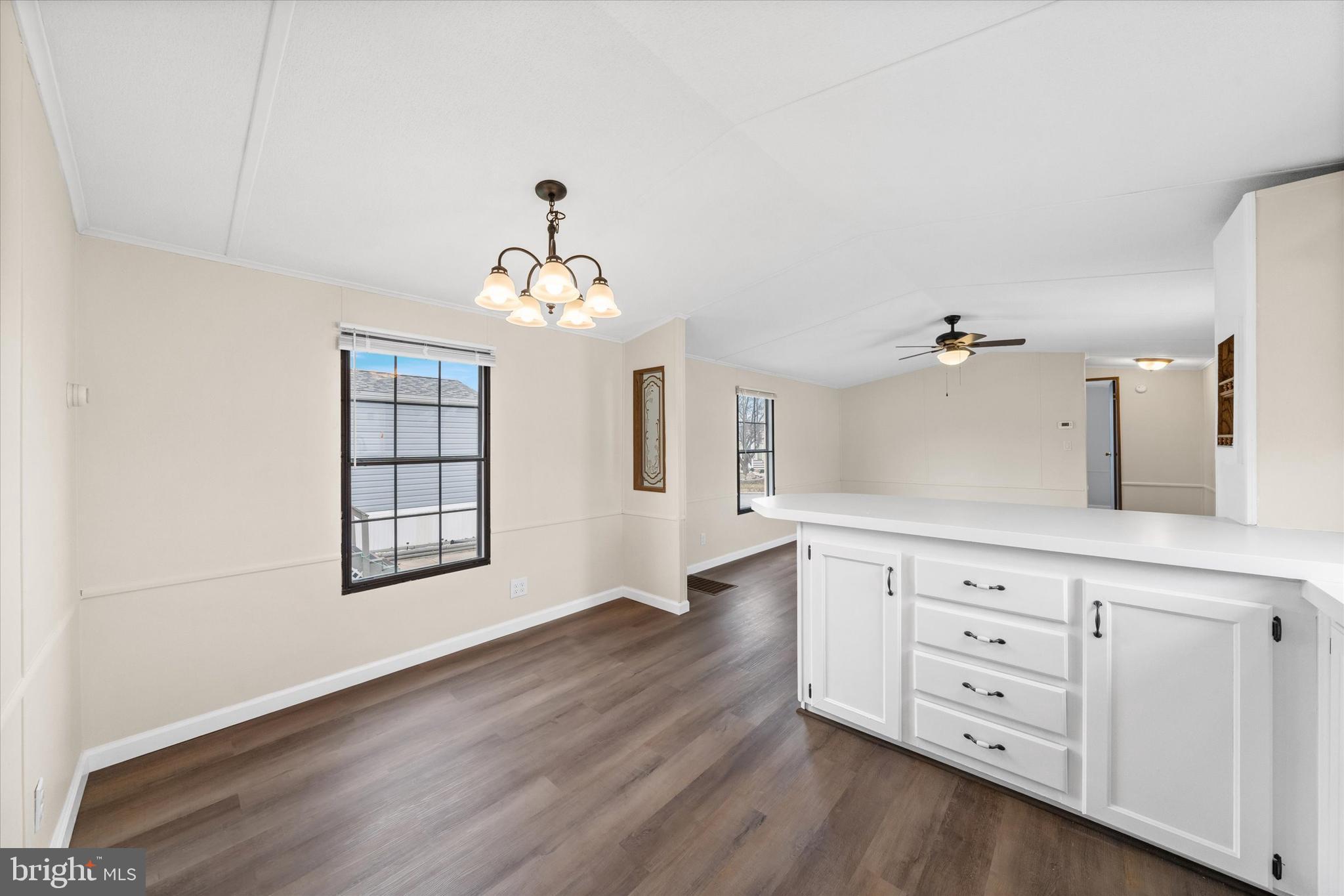 416 Ranee Loop, Unit 96 Bear, DE 19701 - Photo 12 of 31 wooden floor with white cabinets and window