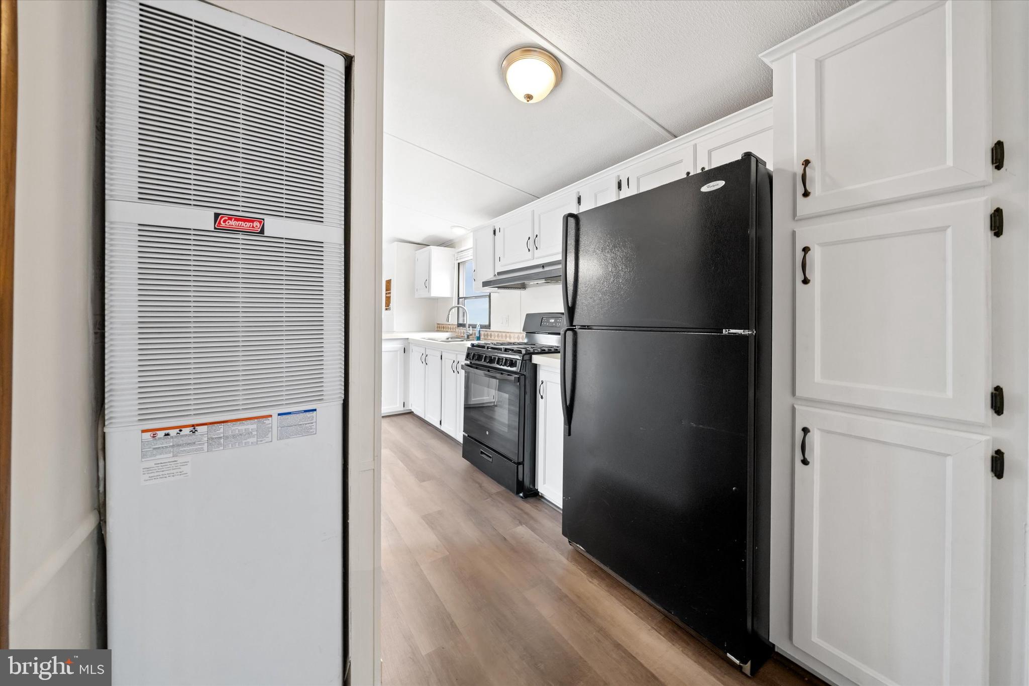 416 Ranee Loop, Unit 96 Bear, DE 19701 - Photo 14 of 31 a view of a kitchen with a refrigerator and a refrigerator