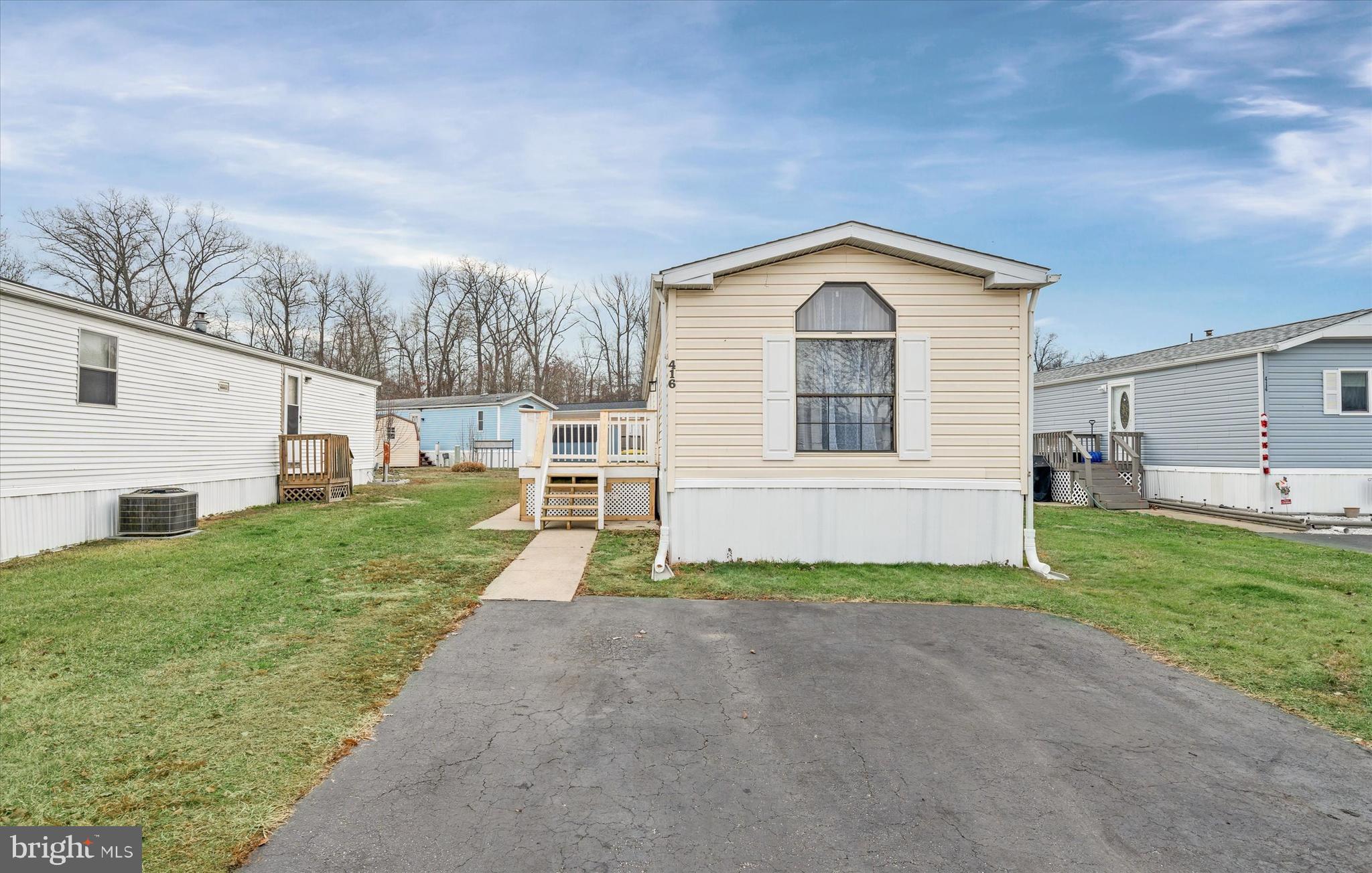 416 Ranee Loop, Unit 96 Bear, DE 19701 - Photo 2 of 31 a front view of a house with a yard