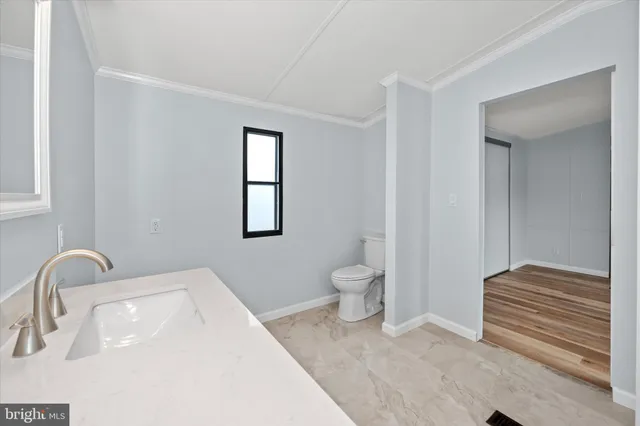 a bathroom with a sink and a toilet