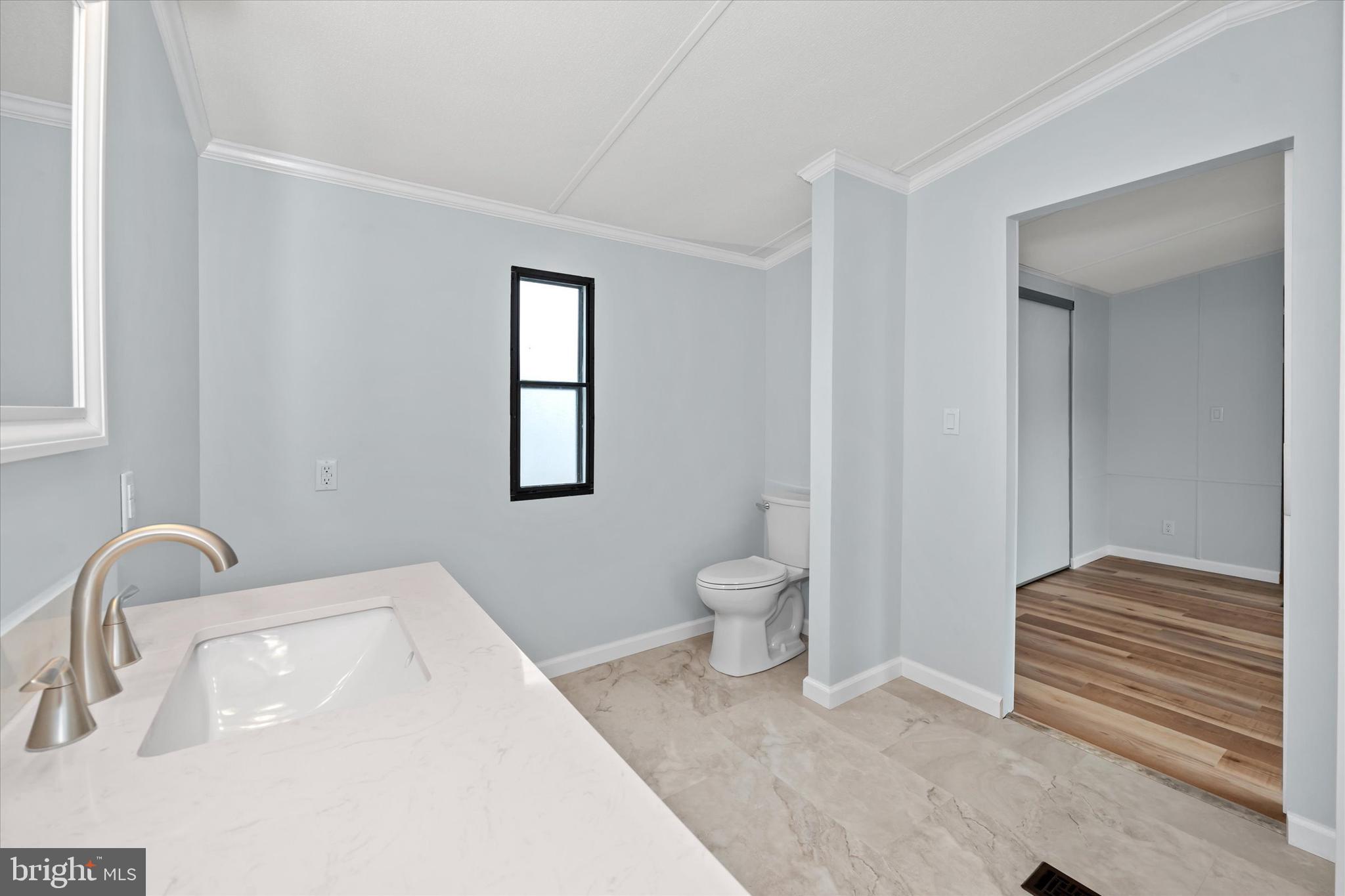 416 Ranee Loop, Unit 96 Bear, DE 19701 - Photo 22 of 31 a bathroom with a sink and a toilet