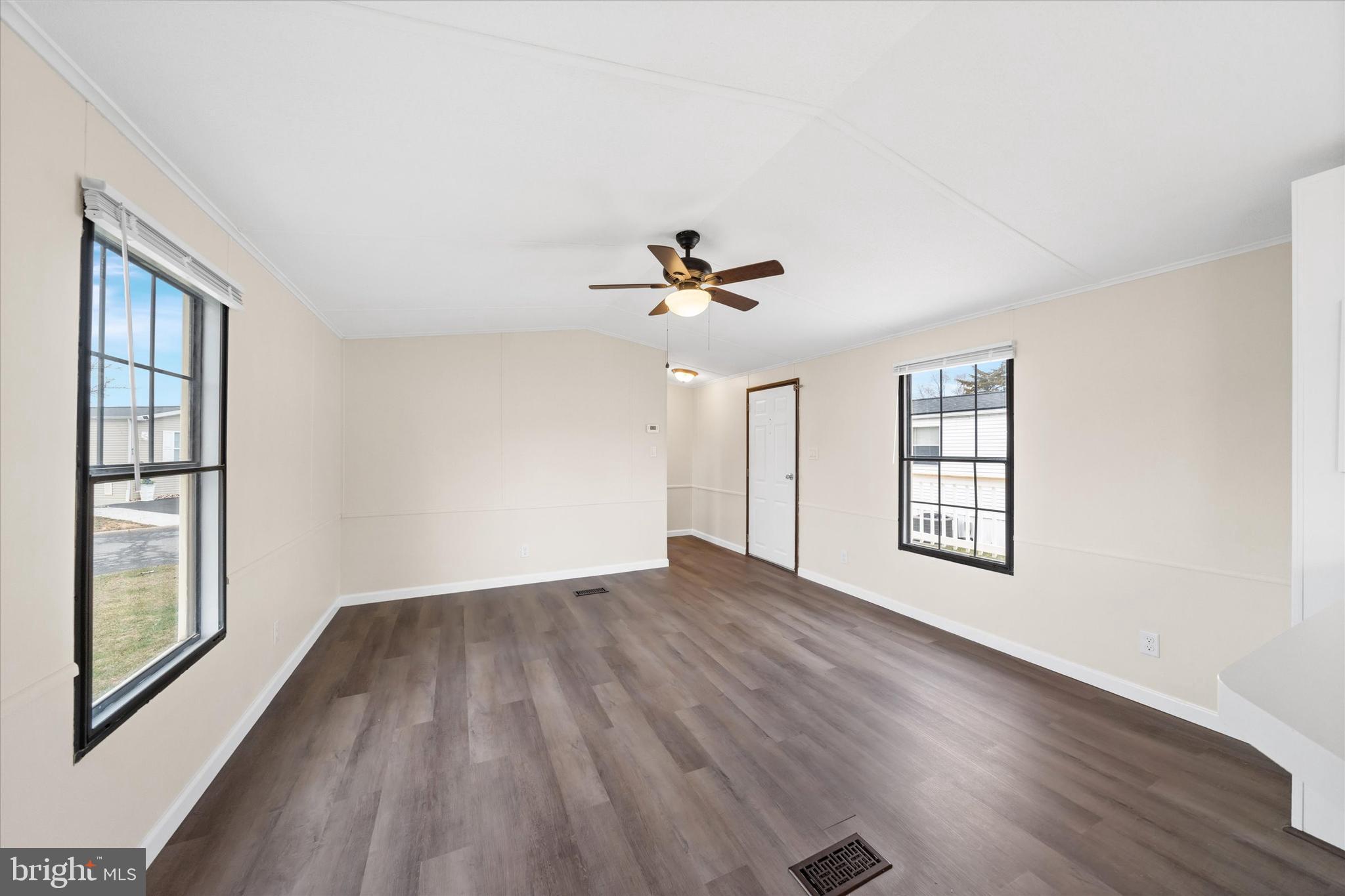 416 Ranee Loop, Unit 96 Bear, DE 19701 - Photo 23 of 31 a view of an empty room with wooden floor and a window