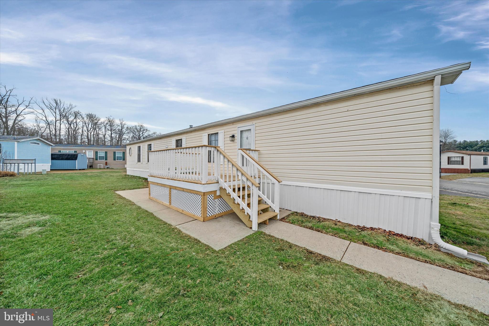 416 Ranee Loop, Unit 96 Bear, DE 19701 - Photo 27 of 31 a view of house with yard and staircase
