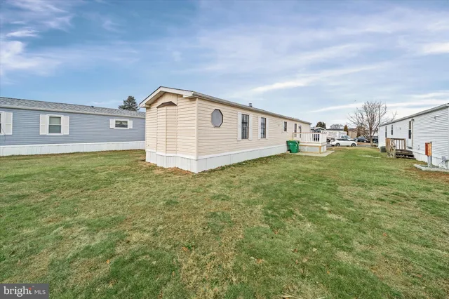 a big house with a big yard and large trees