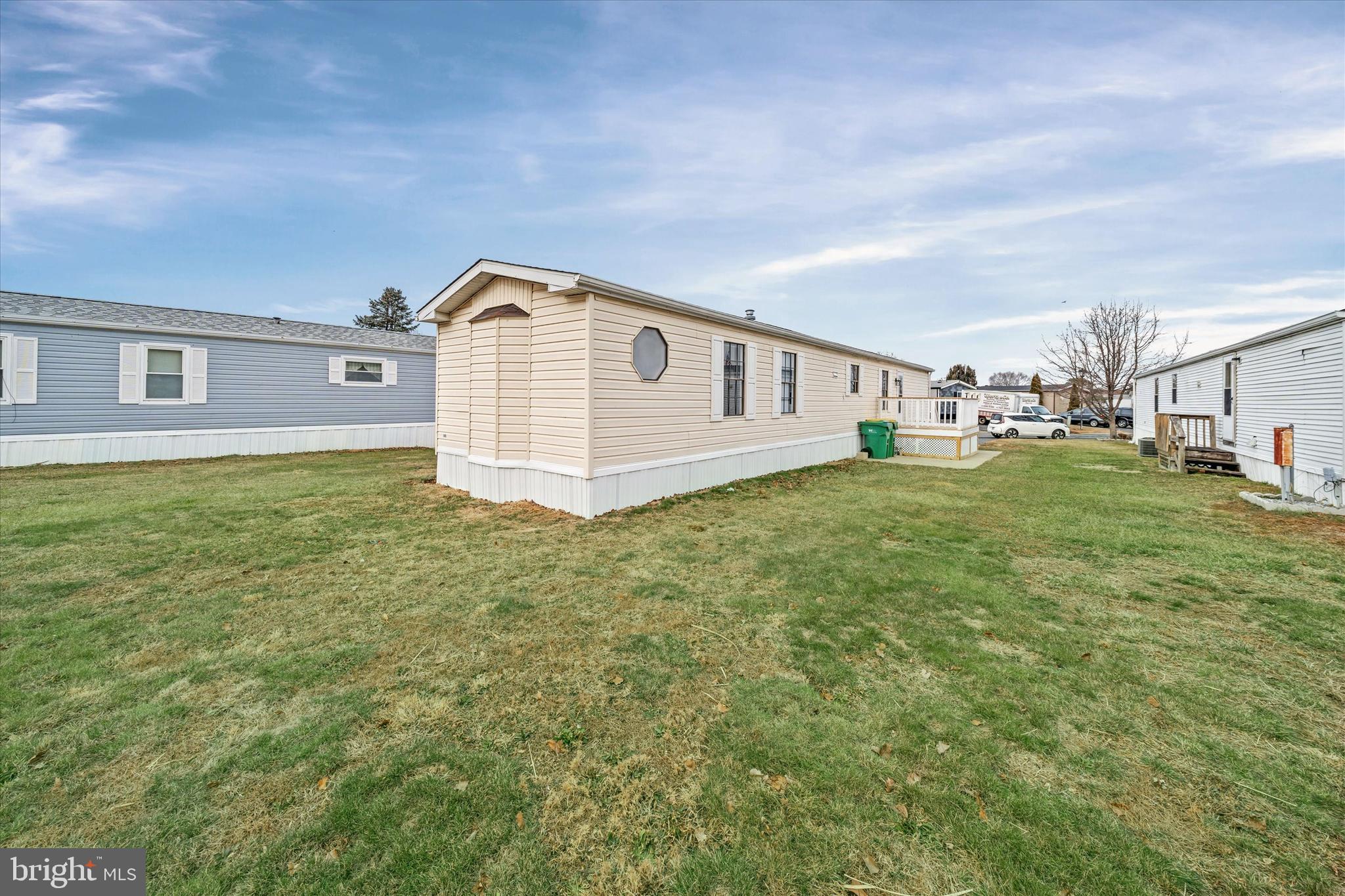 416 Ranee Loop, Unit 96 Bear, DE 19701 - Photo 29 of 31 a big house with a big yard and large trees