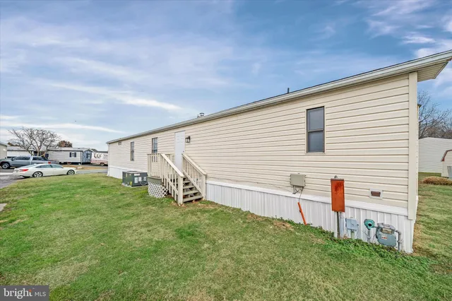 a view of a backyard with sitting area