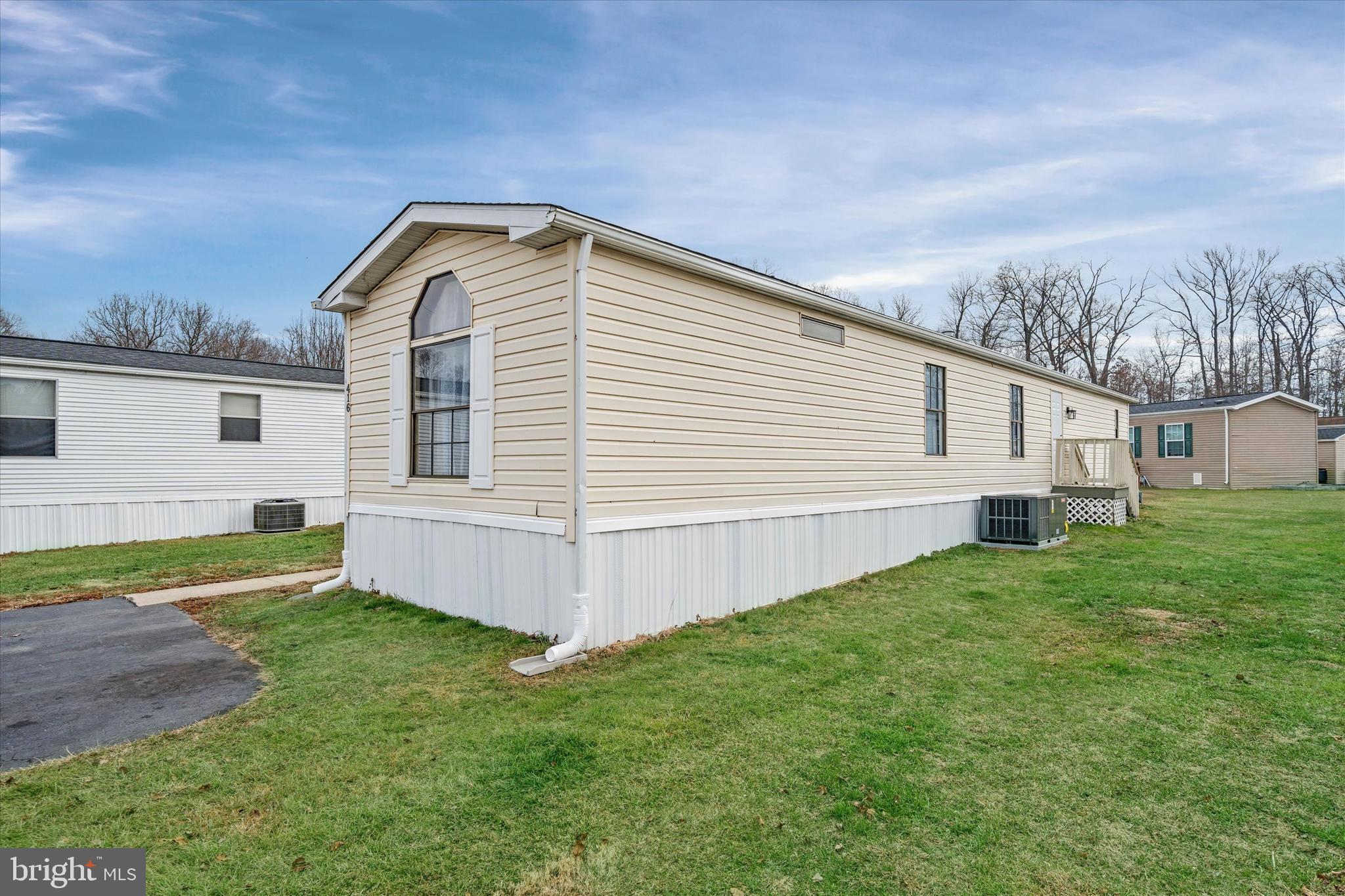 416 Ranee Loop, Unit 96 Bear, DE 19701 - Photo 31 of 31 a view of a backyard with plants and a garden