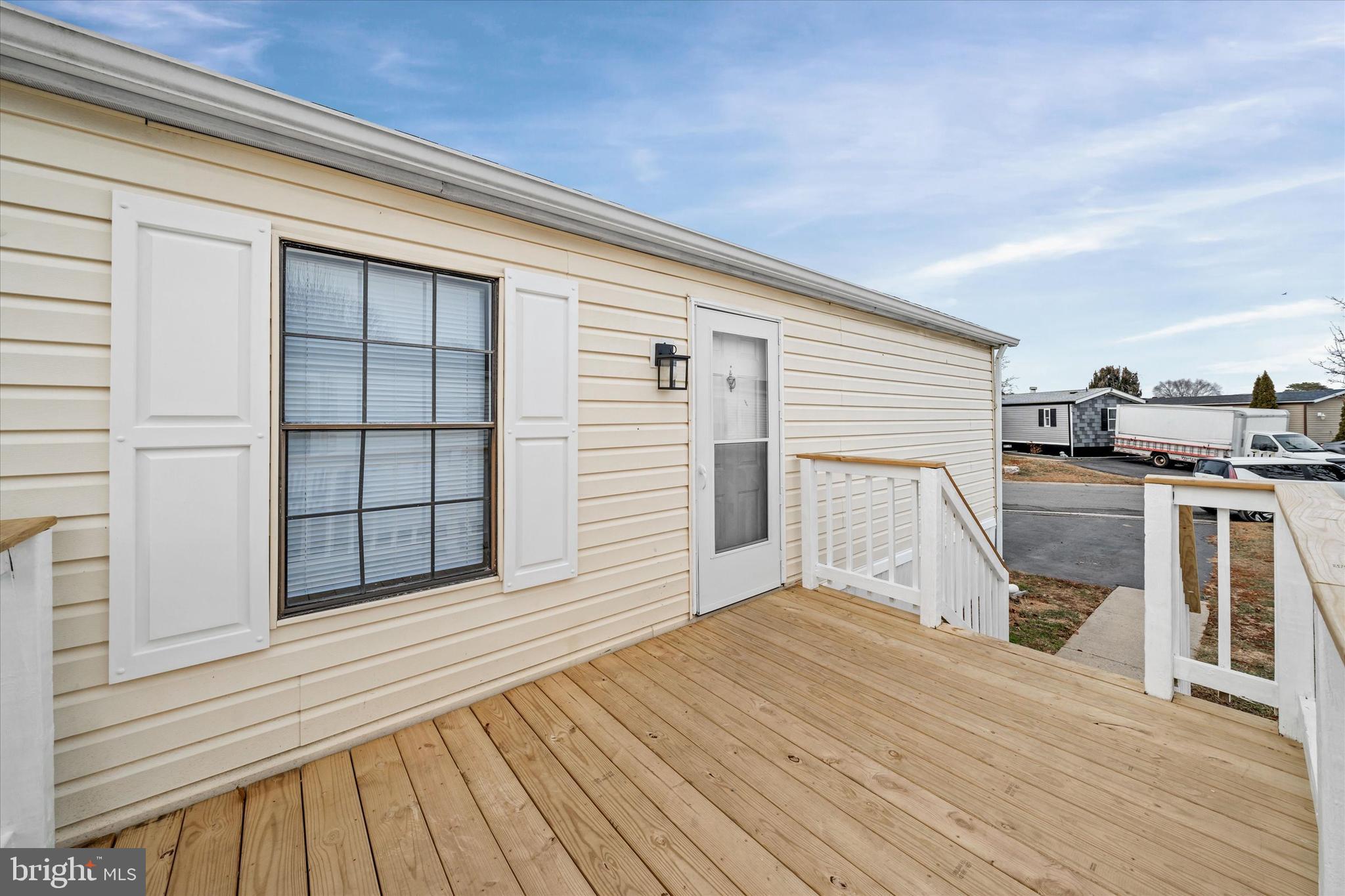 416 Ranee Loop, Unit 96 Bear, DE 19701 - Photo 4 of 31 a view of a kitchen with wooden floor and seating space