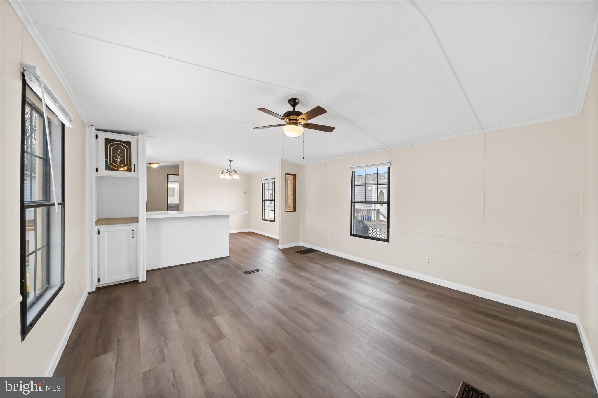 416 Ranee Loop, Unit 96 Bear, DE 19701 - Photo 5 of 31 wooden floor in an empty room with a window