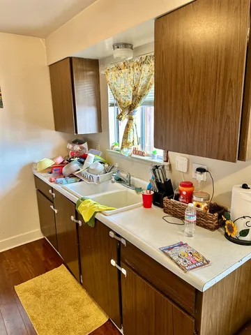a bathroom with a sink vanity and a mirror