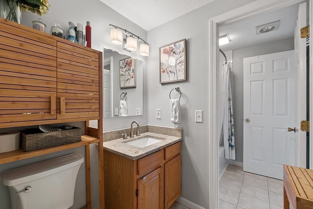 55 Littleton Road, Unit 2F Ayer, MA 01432 - Photo 17 of 29 a bathroom with a sink and a mirror
