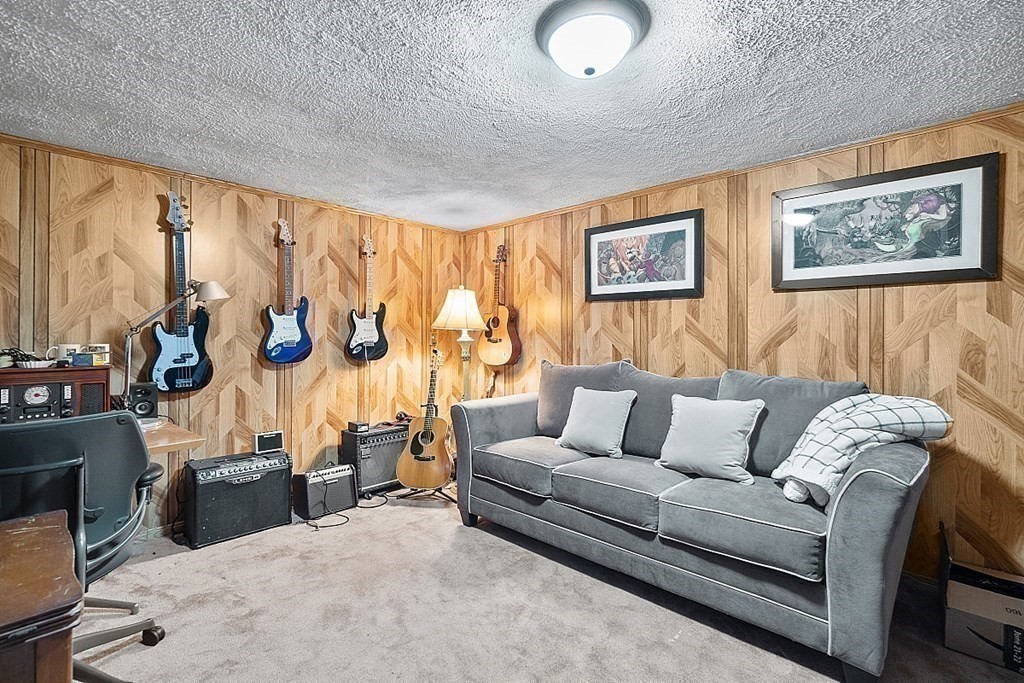 55 Littleton Road, Unit 2F Ayer, MA 01432 - Photo 21 of 29 a living room with furniture and a floor to ceiling window