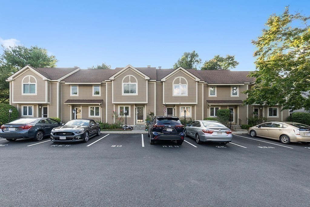 55 Littleton Road, Unit 2F Ayer, MA 01432 - Photo 29 of 29 a car parked in front of a house
