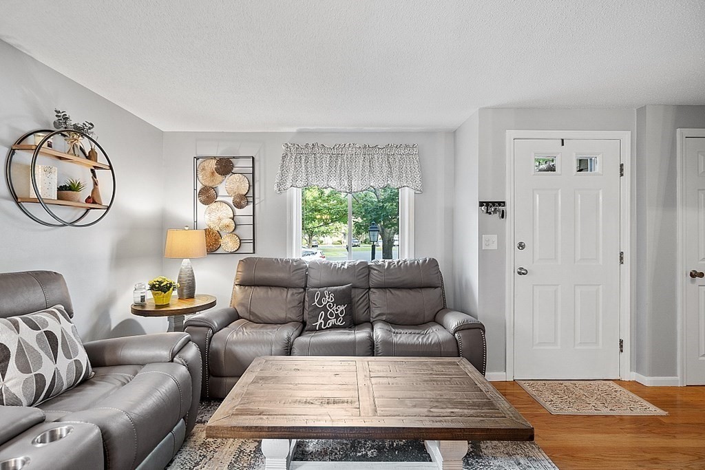 55 Littleton Road, Unit 2F Ayer, MA 01432 - Photo 3 of 29 a living room with furniture and a window