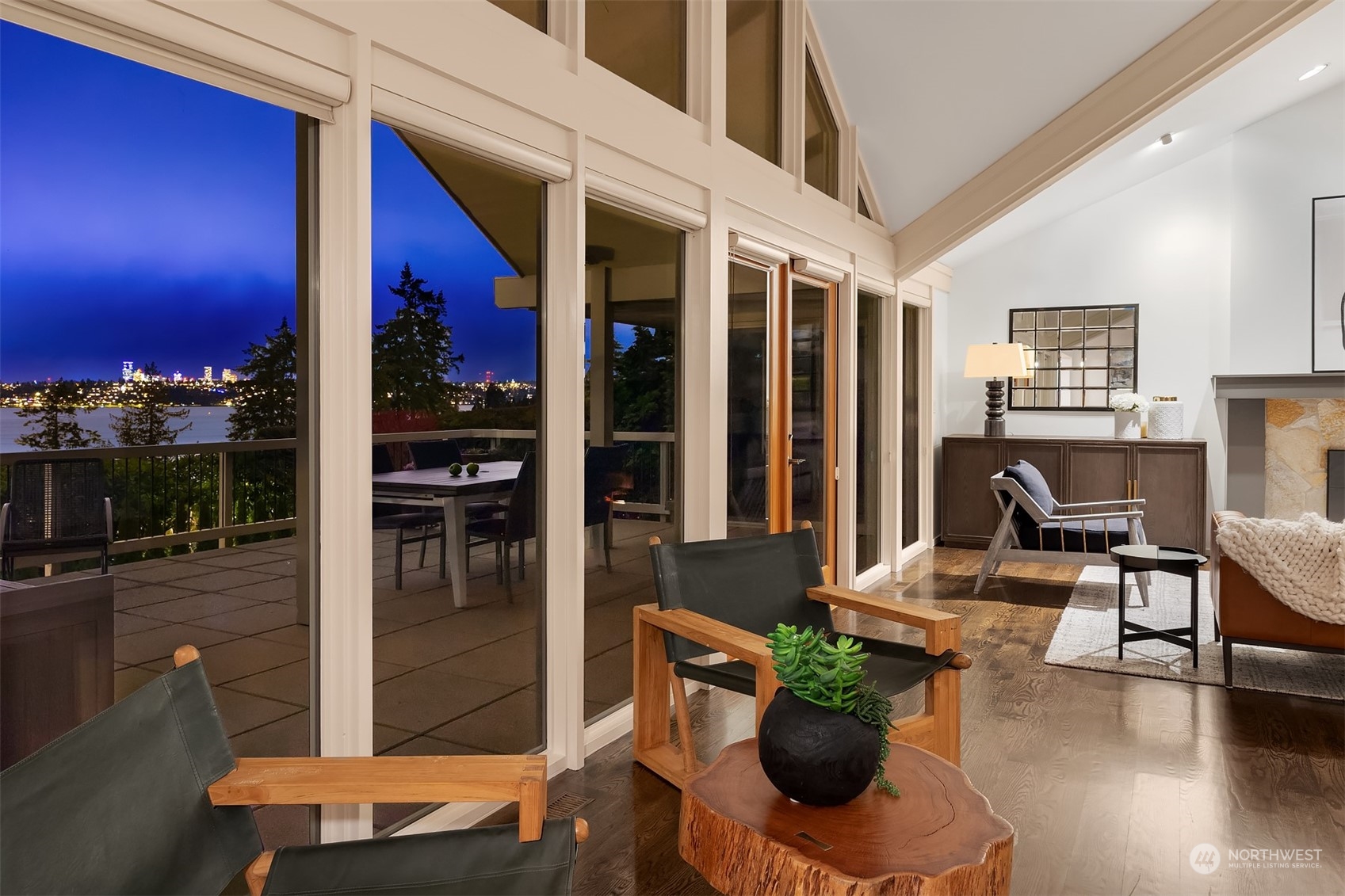 8457 Midland Road Medina, WA 98039 - Photo 13 of 40 a living room with furniture a lamp and potted plants