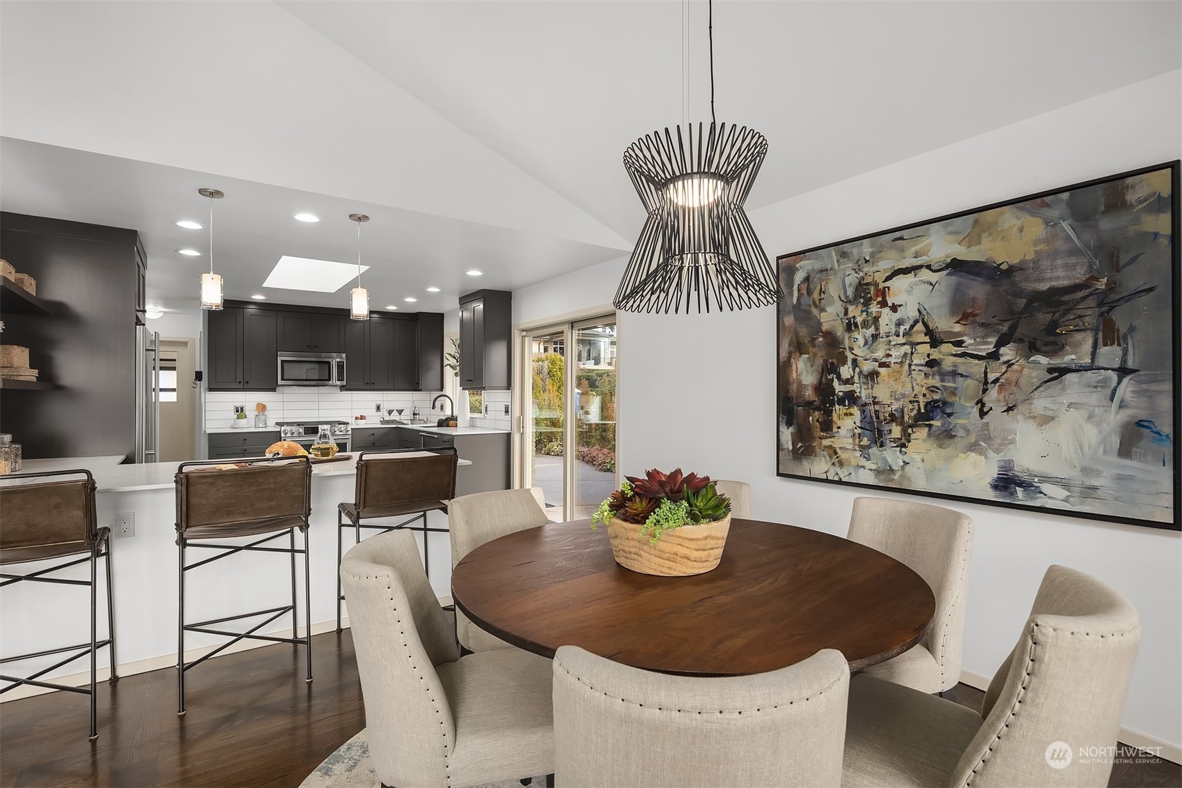 8457 Midland Road Medina, WA 98039 - Photo 14 of 40 a dining room with furniture a window and kitchen view