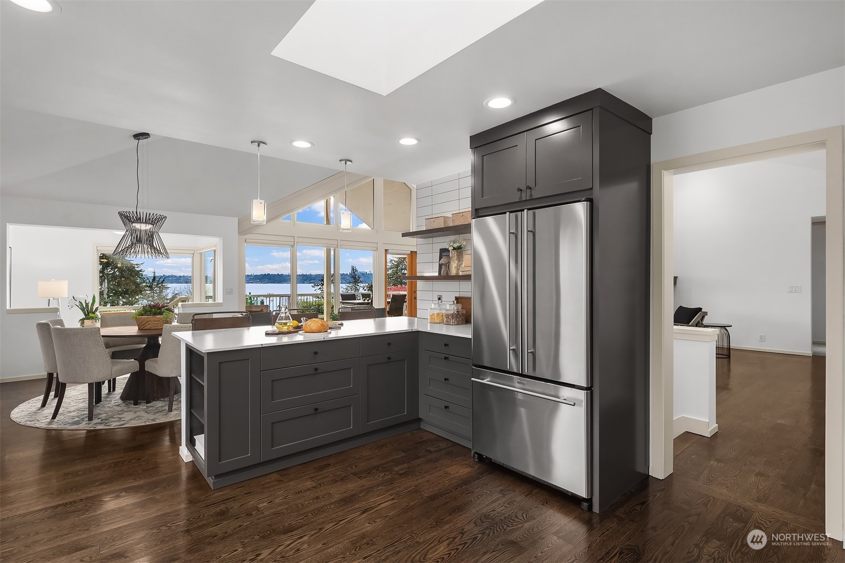 8457 Midland Road Medina, WA 98039 - Photo 21 of 40 a kitchen with stainless steel appliances granite countertop a refrigerator and a stove top oven