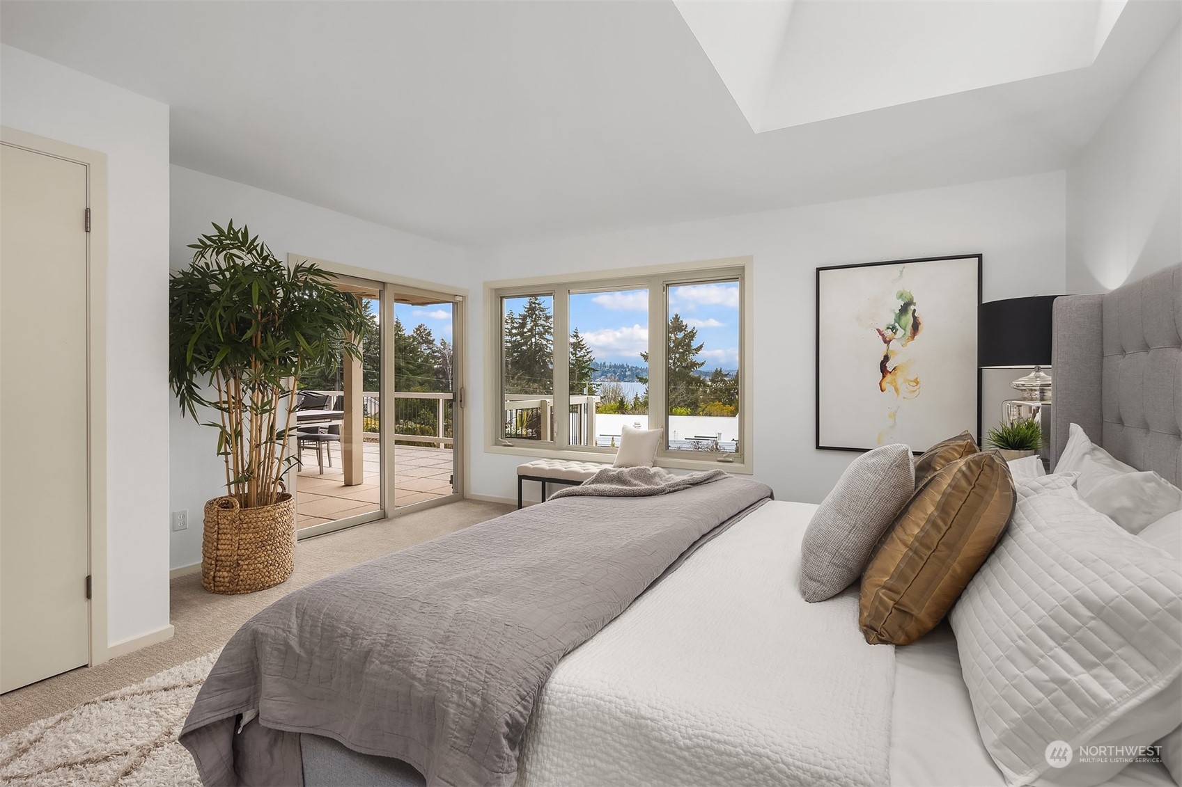 8457 Midland Road Medina, WA 98039 - Photo 23 of 40 a large bedroom with a large bed and a large window