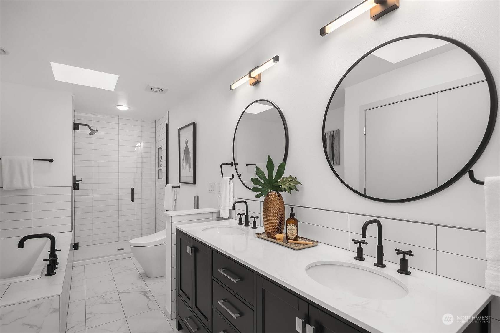 8457 Midland Road Medina, WA 98039 - Photo 25 of 40 a bathroom with a double vanity sink and a mirror