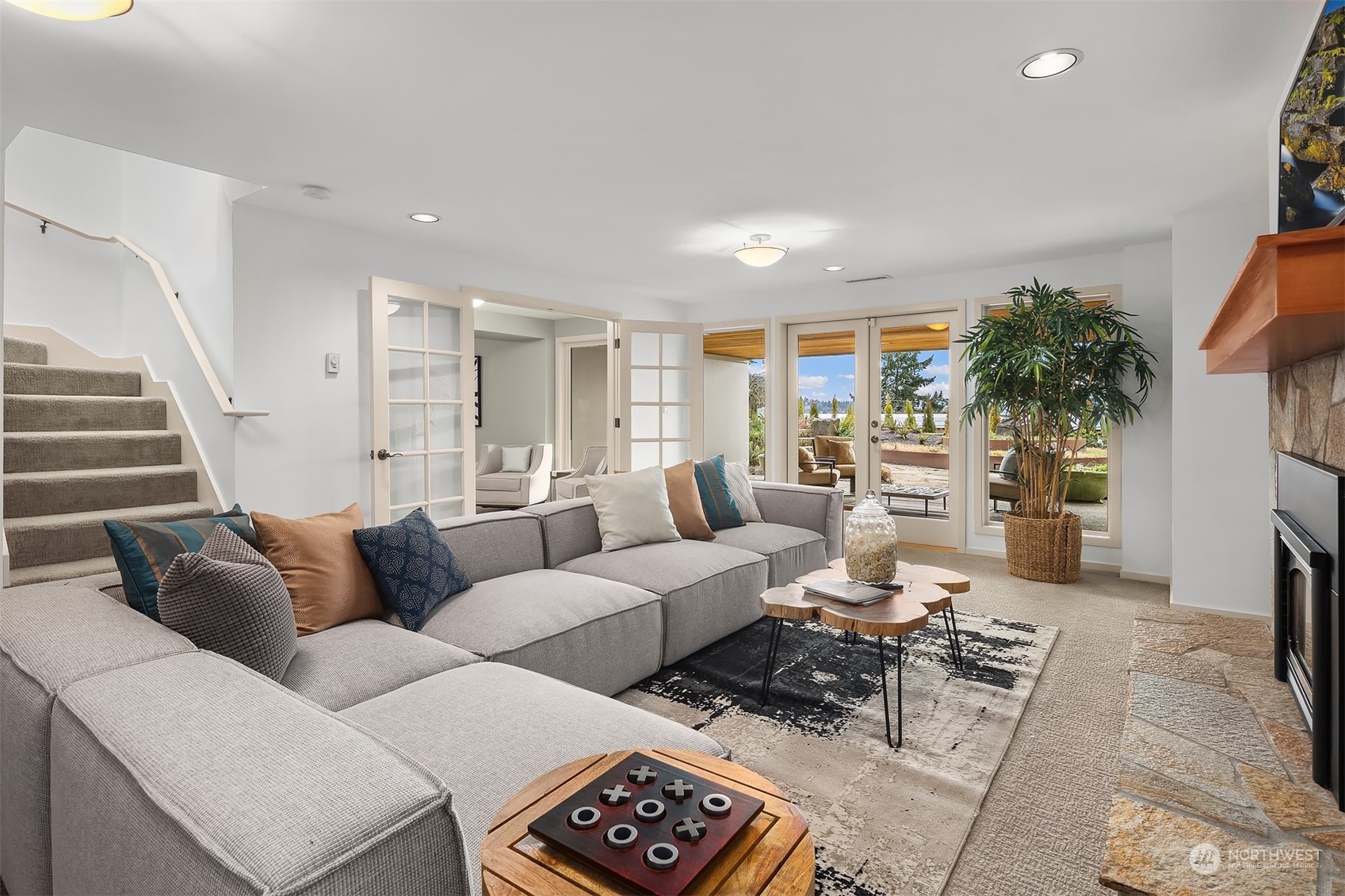 8457 Midland Road Medina, WA 98039 - Photo 28 of 40 a living room with furniture potted plant and a window