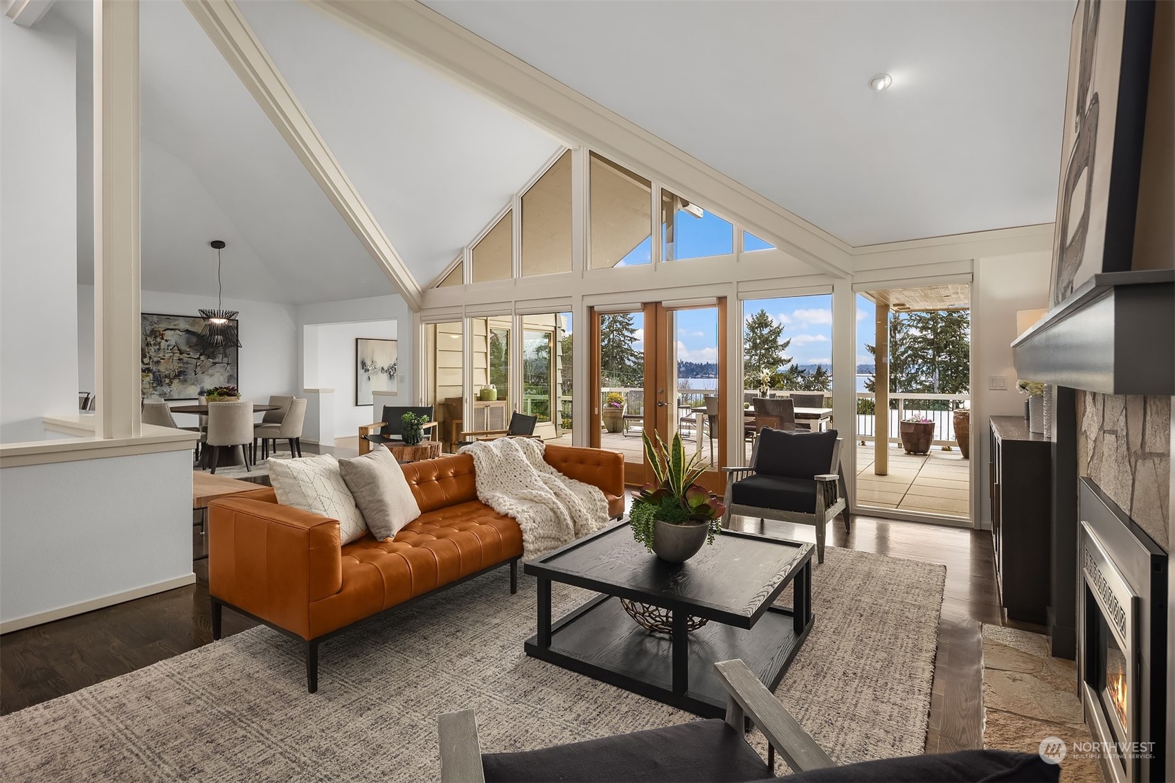 8457 Midland Road Medina, WA 98039 - Photo 6 of 40 a living room with furniture a fireplace and a table