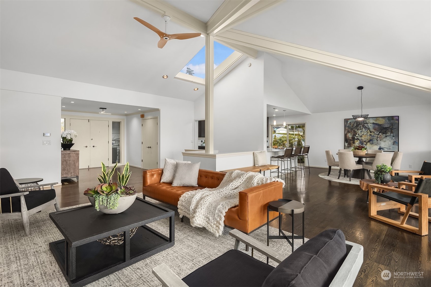 8457 Midland Road Medina, WA 98039 - Photo 9 of 40 a living room with furniture a rug and a chandelier