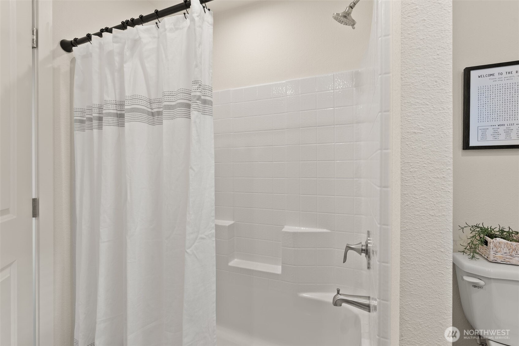1243 Southwest Elzina Street Chehalis, WA 98532 - Photo 20 of 30 a bathroom with a shower curtain