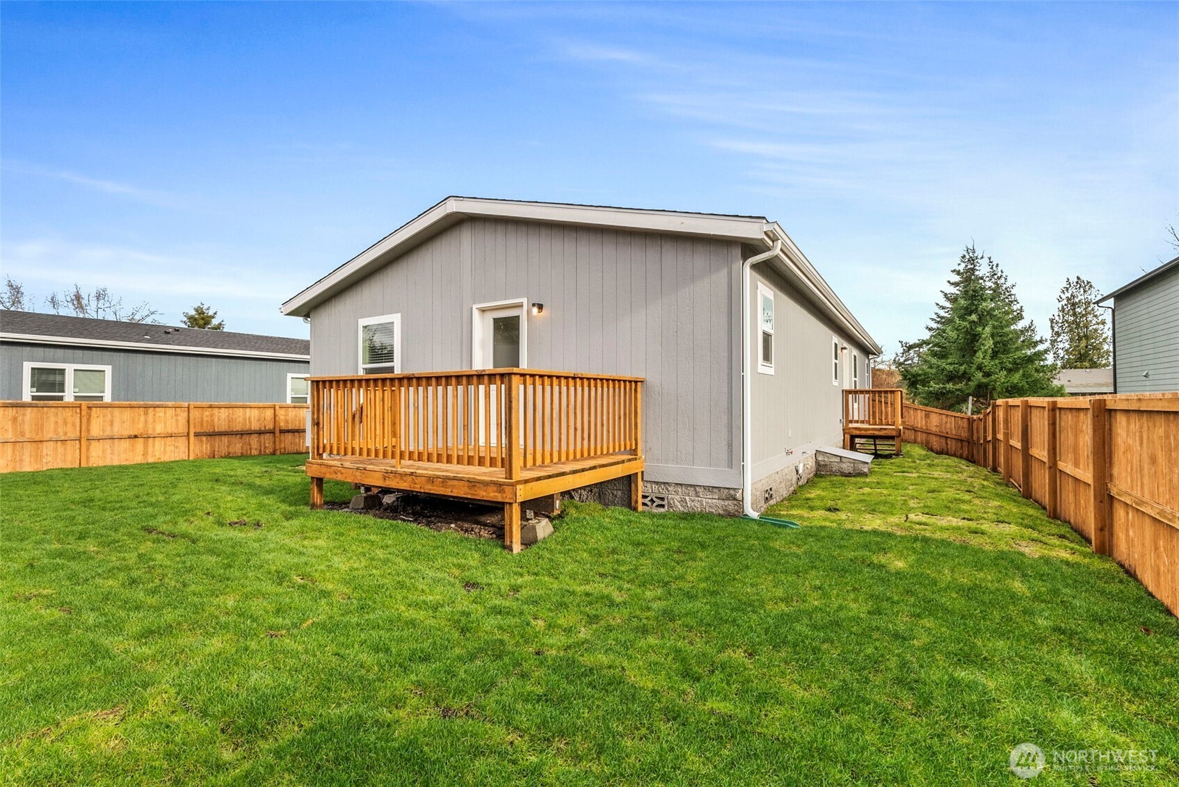 1243 Southwest Elzina Street Chehalis, WA 98532 - Photo 24 of 30 a view of a backyard with a garden and deck