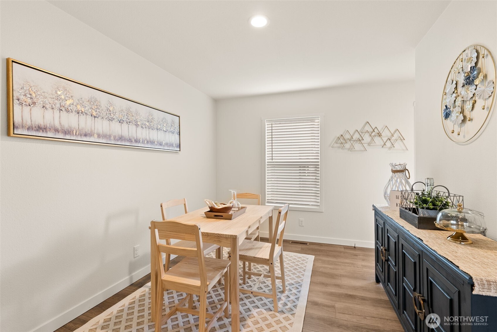 1243 Southwest Elzina Street Chehalis, WA 98532 - Photo 5 of 30 a view of a dining room with furniture and wooden floor
