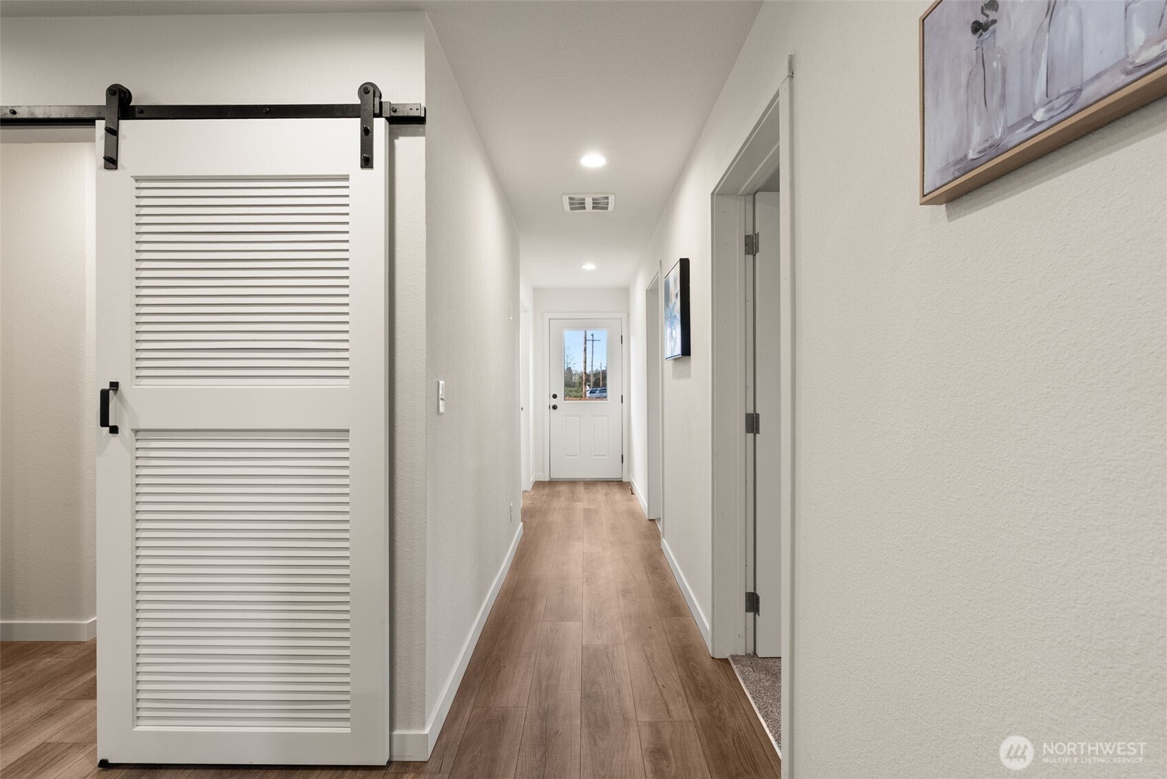 1243 Southwest Elzina Street Chehalis, WA 98532 - Photo 7 of 30 a view of a hallway with wooden floor and staircase