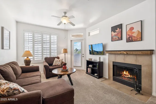 a living room with furniture and a fireplace