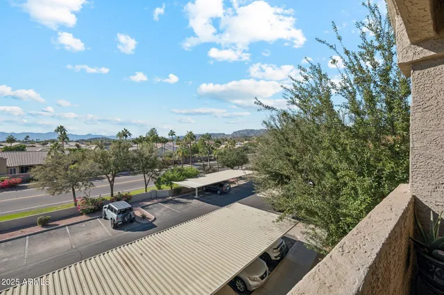 a view of a terrace with couches and sky view
