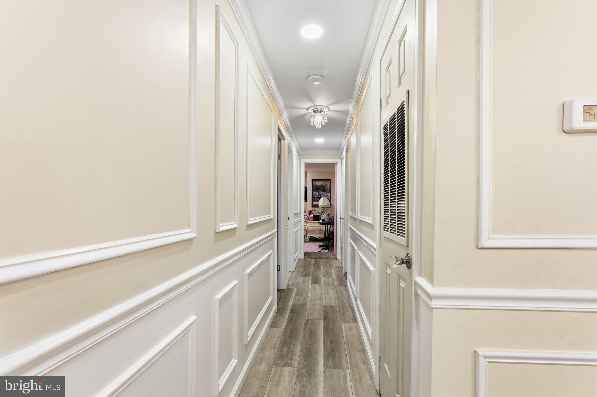 252 Red Pump Road Rising Sun, MD 21911 - Photo 28 of 41 a view of a hallway with wooden floor and staircase