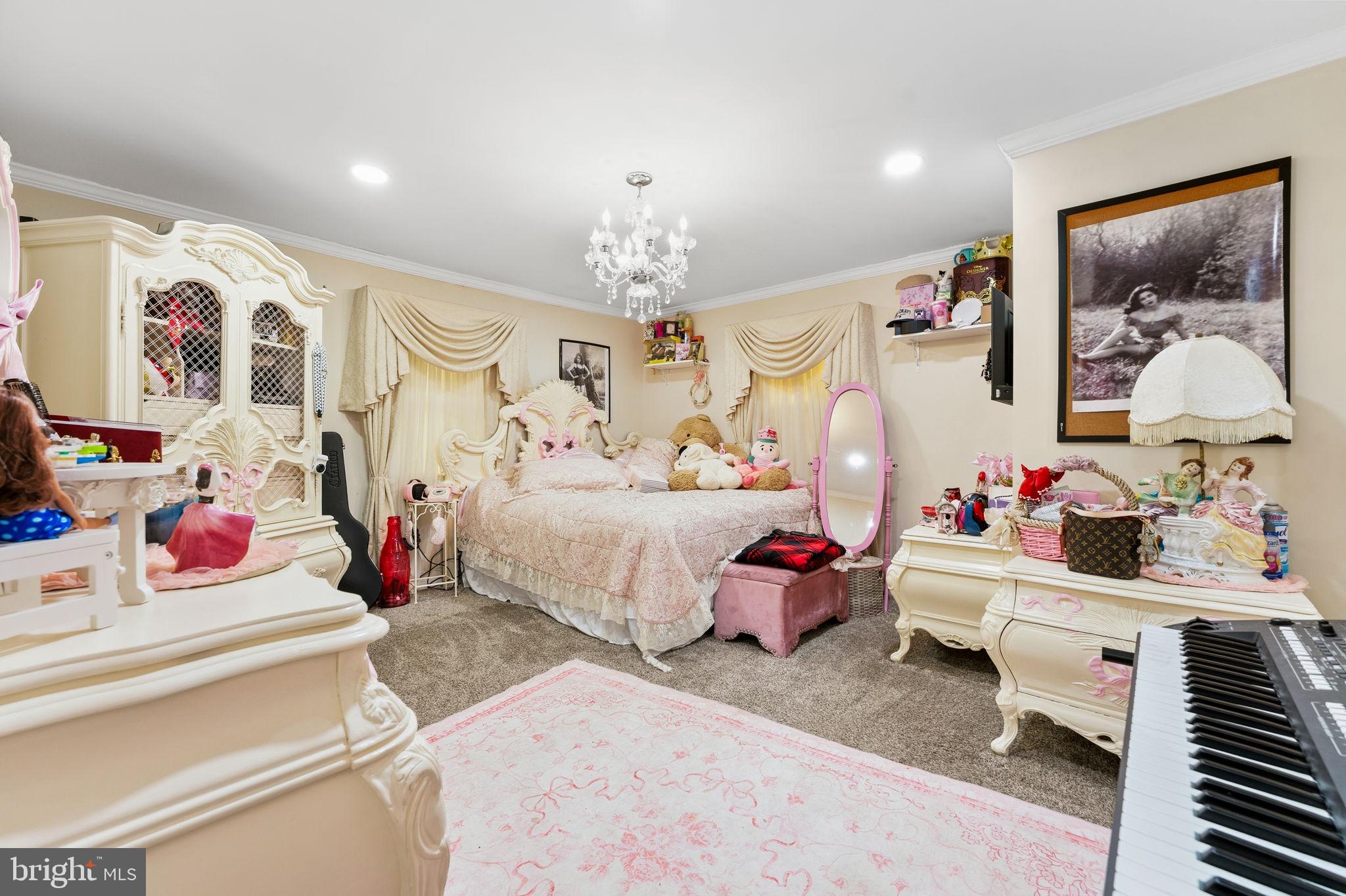 252 Red Pump Road Rising Sun, MD 21911 - Photo 35 of 41 a bedroom with furniture and a chandelier