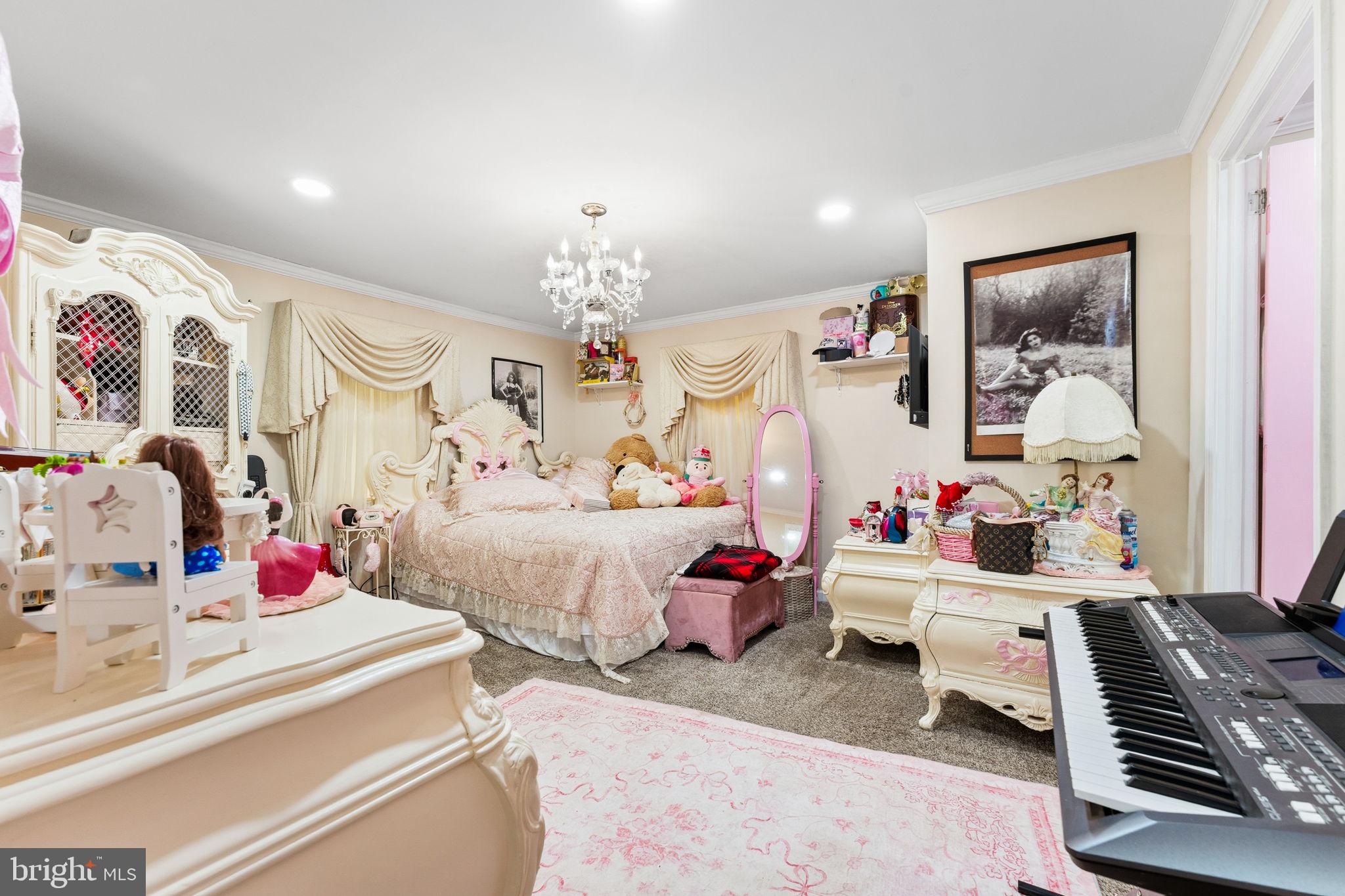 252 Red Pump Road Rising Sun, MD 21911 - Photo 36 of 41 a bedroom with furniture and a chandelier