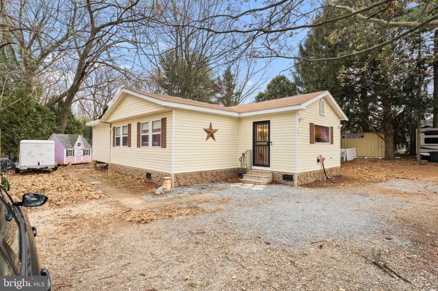 a view of a house with a snow in the yard