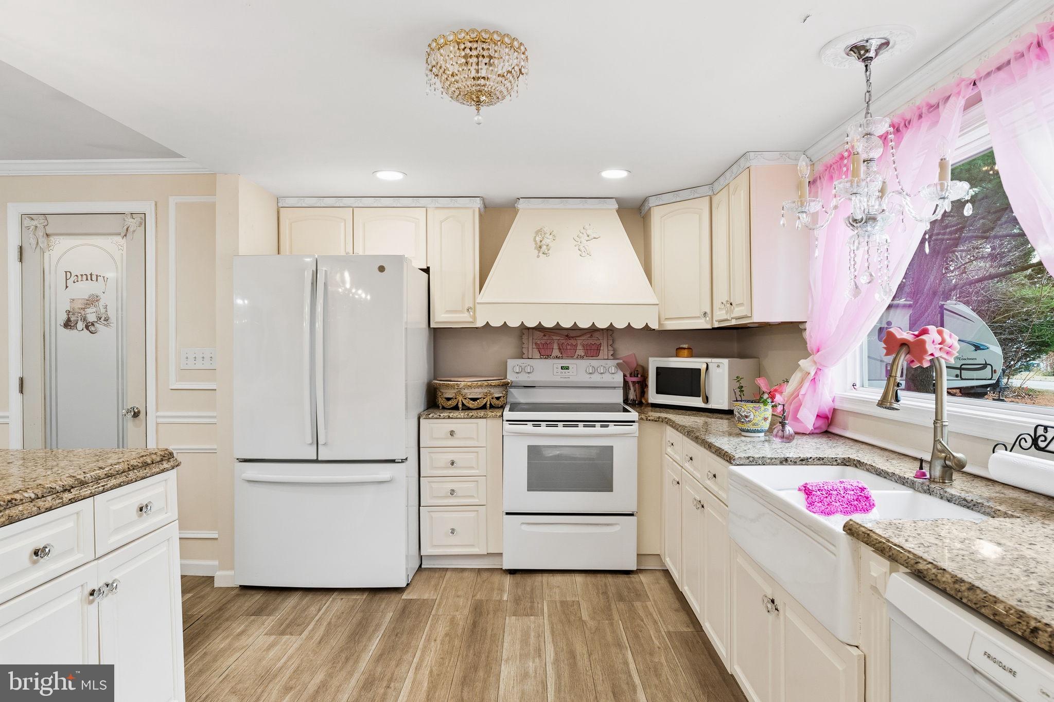 252 Red Pump Road Rising Sun, MD 21911 - Photo 10 of 41 a kitchen with white cabinets and white appliances