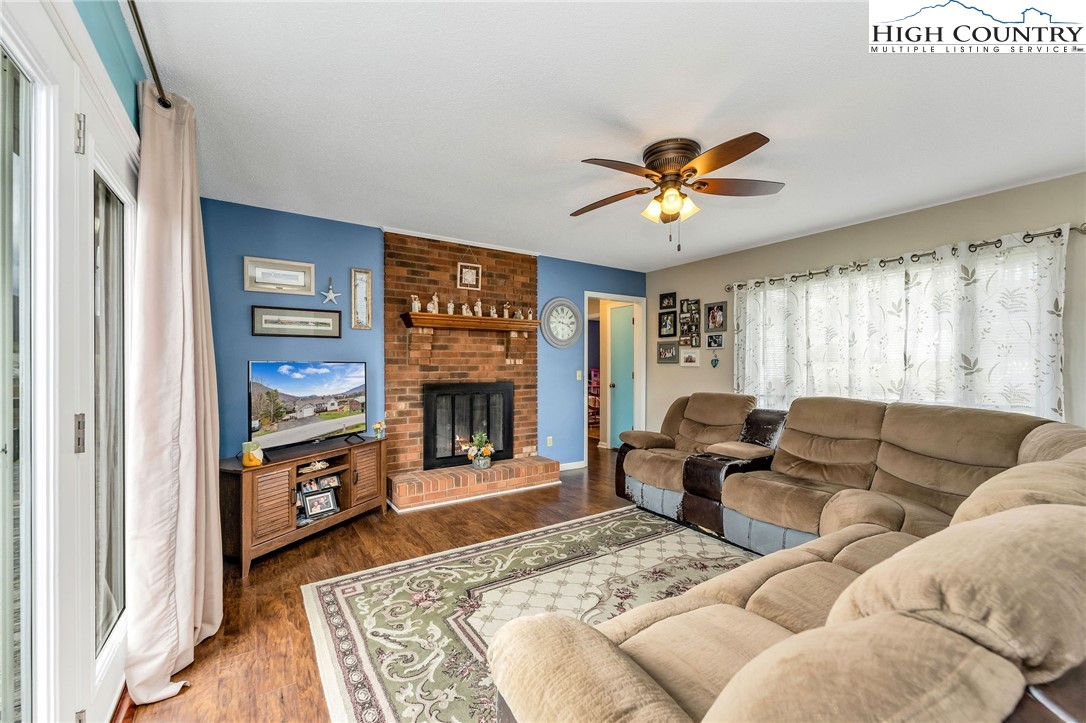 237 Valleyview Drive Jefferson, NC 28640 - Photo 13 of 42 a living room with furniture and a fireplace