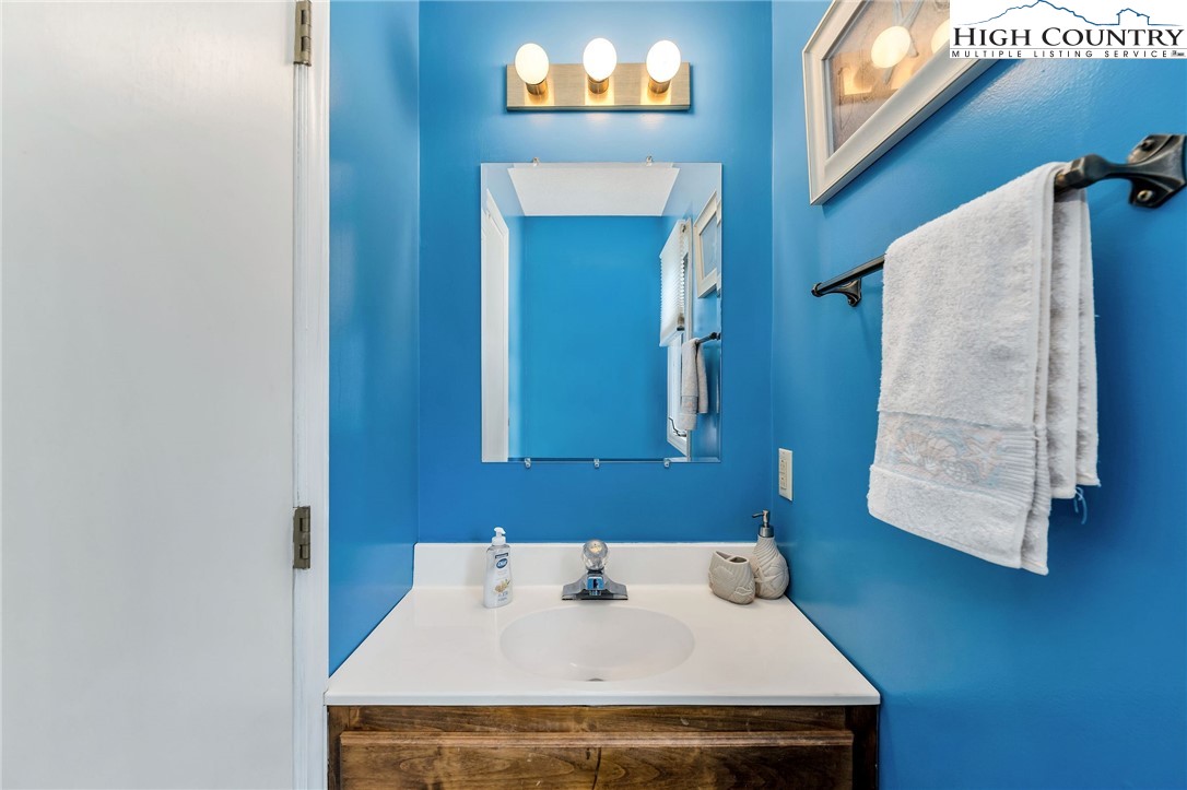 237 Valleyview Drive Jefferson, NC 28640 - Photo 20 of 42 a bathroom with a sink and a mirror