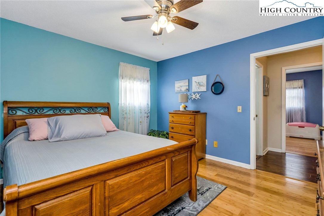 237 Valleyview Drive Jefferson, NC 28640 - Photo 23 of 42 a bedroom with bed and wooden floor
