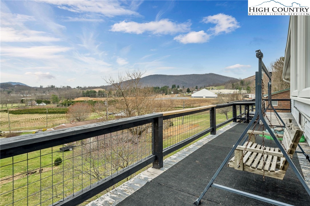 237 Valleyview Drive Jefferson, NC 28640 - Photo 31 of 42 a view of city from a balcony with furniture