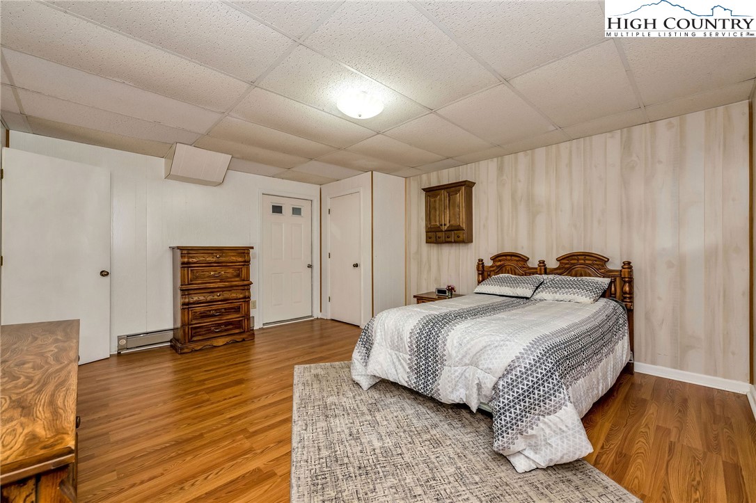 237 Valleyview Drive Jefferson, NC 28640 - Photo 41 of 42 a spacious bedroom with a bed and a dresser