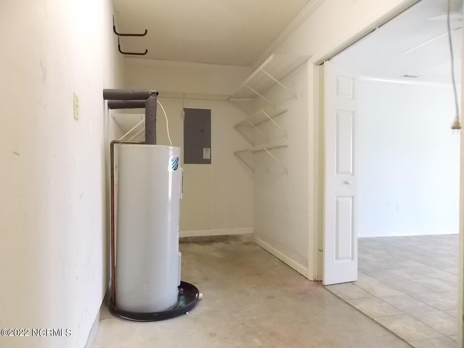881 Sand Ridge Road Hubert, NC 28539 - Photo 22 of 25 Washer/Dryer & storage area in bonus room