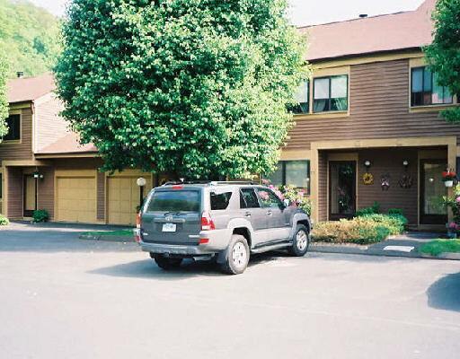 75 Deer Run, Unit 75 Bethel, CT 06801 - Photo 1 of 1 a car parked in front of a house
