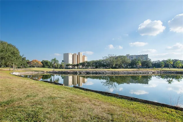 a view of a lake with houses in the back