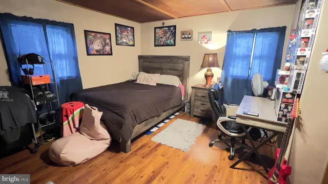 a bedroom with furniture and a chair